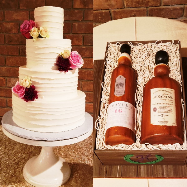 Traditional white wedding cake with pink roses. Custom grooms cake shaped like  whiskey crate with two bottles.